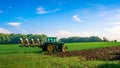 Tractor farm. Agriculture farm machinery on landscape land field. Farmer machine equipment for crop. Tractor farm fields