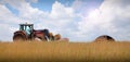 Tractor on farm landscape Royalty Free Stock Photo