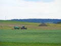 Tractor on farm landscape Royalty Free Stock Photo