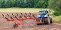 Tractor farming machine on the field