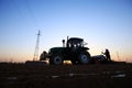 The tractor in farmland farming Royalty Free Stock Photo