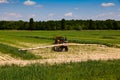 Tractor fertilize field Spraying pesticide and insecticide Royalty Free Stock Photo