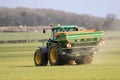 Tractor and fertilizer spreader in field