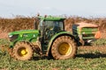 Tractor and fertilizer spreader in field