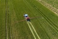 Tractor fertilizes crops