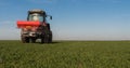 tractor fertilizing in field
