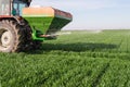 Tractor fertilizing in field