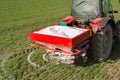 Tractor fertilizing in field