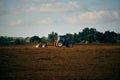 Tractor on field in countryside Royalty Free Stock Photo