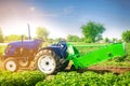 Tractor in the field with a plow for digging potatoes harvesting, seasonal work, fresh vegetables, agro-culture, farming, close-up Royalty Free Stock Photo