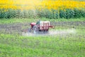 Tractor on the field in summer. Royalty Free Stock Photo