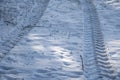 Tractor footprint snow Winter season. Abstract pattern.