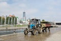Tractor and fountains in Plotinka park, Yekaterinburg city, Russia