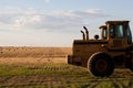 Tractor in a fresh cut hay field Royalty Free Stock Photo