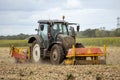 Tractor grubbing onion field