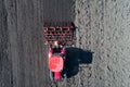 Tractor harrowing soil in spring