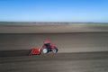 Tractor harrowing soil in spring