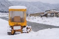 Tractor harvesting snow plow cleaning a road at Japan Royalty Free Stock Photo