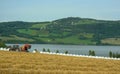 Tractor harvests hay for pets Royalty Free Stock Photo