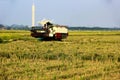 The tractor has finished harvesting the rice field Royalty Free Stock Photo