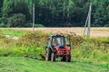 The tractor on the hay in Russia.