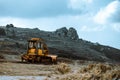 Tractor on the hill in Paphos district under blue sky