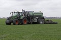 Big tractor injects liquid manure in a meadow Royalty Free Stock Photo