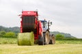 Tractor and lely baler Royalty Free Stock Photo