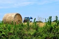 Tractor loading hay bales Royalty Free Stock Photo