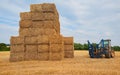 Stacked Hay and a tractor