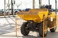 Tractor for the maintenance and repair of the asphalt and pavements of a street in a large city. Heavy machinery and construction Royalty Free Stock Photo