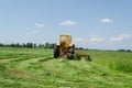 Tractor make sharp turn and leaves cut grass tufts