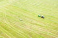 tractor makes hay from above