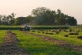 Tractor making Hay bales Royalty Free Stock Photo