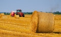 Tractor making hay bales on agricultural field Royalty Free Stock Photo