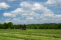 Tractor making hay on the farm in Quebec, Canada Royalty Free Stock Photo