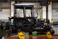 Tractor Manufacture work. Assembly line inside the agricultural machinery factory.