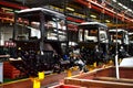 Tractor Manufacture work. Assembly line inside the agricultural machinery factory.