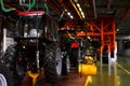 Tractor Manufacture work. Assembly line inside the agricultural machinery factory.