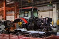 Tractor Manufacture work. Assembly line inside the agricultural machinery factory