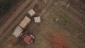 Tractor moves large wooden crates