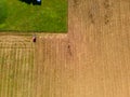 Tractor mowing agricultural  field. Aerial view.  Cultivating field. Royalty Free Stock Photo