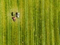 Tractor mowing agricultural field. Aerial view. Cultivating field. Royalty Free Stock Photo