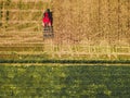 Tractor mowing agricultural  field. Aerial view.  Cultivating field. Royalty Free Stock Photo