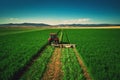 Tractor mowing green field, aerial view Royalty Free Stock Photo