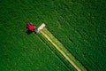 Tractor mowing green field, aerial view Royalty Free Stock Photo