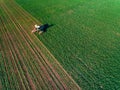 Tractor mowing green field