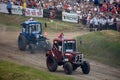 Tractor mud racing on off road terrain. Races on a cross-country terrain on BIZON Truck Show. Royalty Free Stock Photo