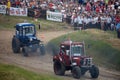 Tractor mud racing on off road terrain. Races on a cross-country terrain on BIZON Truck Show. Royalty Free Stock Photo