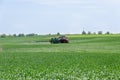 Tractor nozzles fertilizing crops field